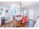 Bright dining room with hardwood floors and large window at 9970 Groomsbridge Rd, Johns Creek, GA 30022