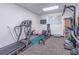 Basement home gym with various exercise equipment at 9970 Groomsbridge Rd, Johns Creek, GA 30022