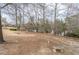 Peaceful community lake with stone bench and walking path at 9970 Groomsbridge Rd, Johns Creek, GA 30022