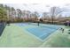 Well-maintained community tennis courts with ample space at 9970 Groomsbridge Rd, Johns Creek, GA 30022