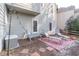 Relaxing side yard with lounge chairs and string lights at 9970 Groomsbridge Rd, Johns Creek, GA 30022