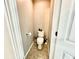 Small half bathroom with toilet and tile floor at 2267 Nottley Walk, Marietta, GA 30066