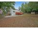 House backyard with deck and storage shed at 1529 Bell Flower Ct, Stone Mountain, GA 30088