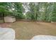 Large backyard with shed and partially fenced-in area at 1529 Bell Flower Ct, Stone Mountain, GA 30088