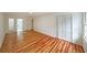 Bright bedroom featuring hardwood floors and ample closet space at 1529 Bell Flower Ct, Stone Mountain, GA 30088