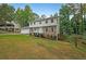 Two-story house with stone accents and a grassy yard at 1529 Bell Flower Ct, Stone Mountain, GA 30088