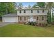 Two-story house with stone accents and a spacious lawn at 1529 Bell Flower Ct, Stone Mountain, GA 30088