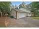 Attached garage with driveway and additional storage at 1529 Bell Flower Ct, Stone Mountain, GA 30088