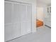 White kitchen with built-in shelving and bi-fold closet doors at 1529 Bell Flower Ct, Stone Mountain, GA 30088