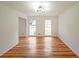 Living room with hardwood floors and large windows at 1529 Bell Flower Ct, Stone Mountain, GA 30088