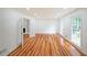 Bright living room with hardwood floors and built-in shelves at 1529 Bell Flower Ct, Stone Mountain, GA 30088