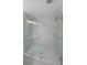 Modern shower with marble walls and glass enclosure at 1529 Bell Flower Ct, Stone Mountain, GA 30088