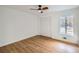 Spacious bedroom with hardwood floors and large window at 1963 Tripp Rd, Woodstock, GA 30188