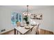 Modern dining room with marble table and updated light fixture at 1963 Tripp Rd, Woodstock, GA 30188