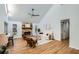 Bright living room featuring hardwood floors and a stone fireplace at 1963 Tripp Rd, Woodstock, GA 30188