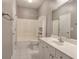 Clean bathroom with tub, shower, white vanity, and mirror at 2500 Rosehill Cir, Lithia Springs, GA 30122