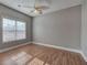 Bright bedroom with wood floors, large window, and ceiling fan at 2500 Rosehill Cir, Lithia Springs, GA 30122