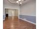 Dining room with hardwood floors and chair railing at 2500 Rosehill Cir, Lithia Springs, GA 30122