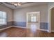 Dining room with hardwood floors and chair railing at 2500 Rosehill Cir, Lithia Springs, GA 30122