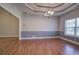 Bright dining room features hardwood floors and a tray ceiling at 2500 Rosehill Cir, Lithia Springs, GA 30122