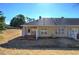 Exterior view of the back of the house with patio and yard at 2500 Rosehill Cir, Lithia Springs, GA 30122