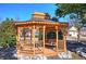 Wooden gazebo with a swing, perfect for relaxing outdoors at 2500 Rosehill Cir, Lithia Springs, GA 30122