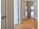 Hardwood floors and neutral walls in this home hallway at 2500 Rosehill Cir, Lithia Springs, GA 30122