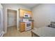 Kitchen with light wood cabinets and white appliances at 2500 Rosehill Cir, Lithia Springs, GA 30122