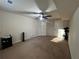 Spacious carpeted bedroom with a ceiling fan and neutral walls at 3280 Hallmark Ln, Buford, GA 30519