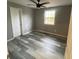 Simple bedroom with gray walls and wood-look flooring at 1591 Woodland Se Ave, Atlanta, GA 30316