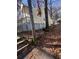 Side of a yellow house with steps leading to the porch at 1591 Woodland Se Ave, Atlanta, GA 30316