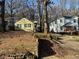 Houses on a tree-lined street with a shared driveway at 1591 Woodland Se Ave, Atlanta, GA 30316