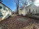 Yellow house with a driveway and neighboring house at 1591 Woodland Se Ave, Atlanta, GA 30316