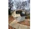 Yellow house with black accents and wooden steps at 1591 Woodland Se Ave, Atlanta, GA 30316