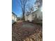 Yellow house with wooden steps and railing, surrounded by trees at 1591 Woodland Se Ave, Atlanta, GA 30316