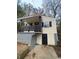 Yellow house with black accents and a wooden porch at 1591 Woodland Se Ave, Atlanta, GA 30316