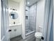 Modern bathroom with white vanity and marble shower at 1626 Saddlecreek Rd, Auburn, GA 30011