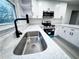 Modern kitchen sink and faucet with quartz countertop at 1626 Saddlecreek Rd, Auburn, GA 30011