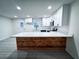 Modern kitchen with white cabinets and a quartz island at 1626 Saddlecreek Rd, Auburn, GA 30011