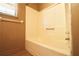 Clean bathroom with tub/shower combo and wood-look floors at 2400 Reynolds Rd Sw, Atlanta, GA 30331