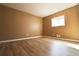 Spacious bedroom with light wood flooring and a large window at 2400 Reynolds Rd Sw, Atlanta, GA 30331