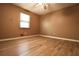 Simple bedroom with light floors and a ceiling fan at 2400 Reynolds Rd Sw, Atlanta, GA 30331