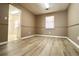 Simple dining area with light wood-look flooring at 2400 Reynolds Rd Sw, Atlanta, GA 30331