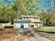 Two-story house with stone accents and a two-car garage at 2400 Reynolds Rd Sw, Atlanta, GA 30331