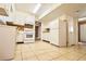 Galley kitchen with white cabinets and tile flooring at 2400 Reynolds Rd Sw, Atlanta, GA 30331