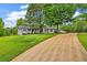 Long driveway leading to a ranch style house at 8926 East Carroll Rd, Winston, GA 30187