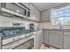 Kitchen with stainless steel appliances and gray cabinets at 8926 East Carroll Rd, Winston, GA 30187