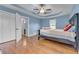 Main bedroom with hardwood floors and a walk-in closet at 8926 East Carroll Rd, Winston, GA 30187