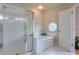 Bathroom with shower, garden tub, and a circular window at 1506 Lavista Proper Cir, Decatur, GA 30033