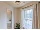 Small bathroom with a bathtub, shower and large window at 1506 Lavista Proper Cir, Decatur, GA 30033